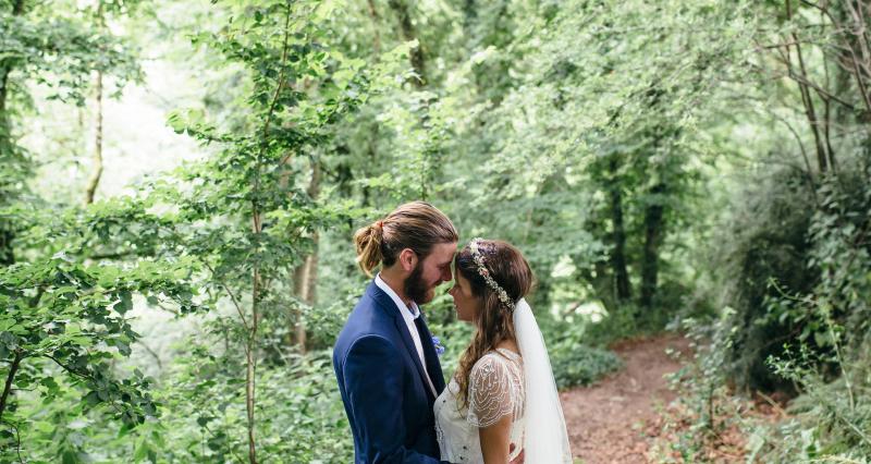 Bride and groom in woodland