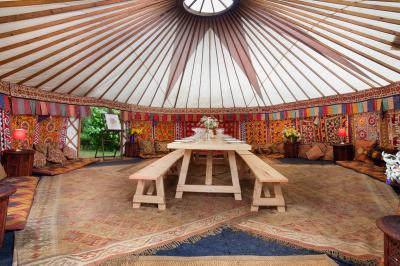 24ft yurt with sumptuous decor and a 12ft banqueting table