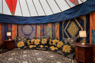 Cushions in a blue 14ft yurt