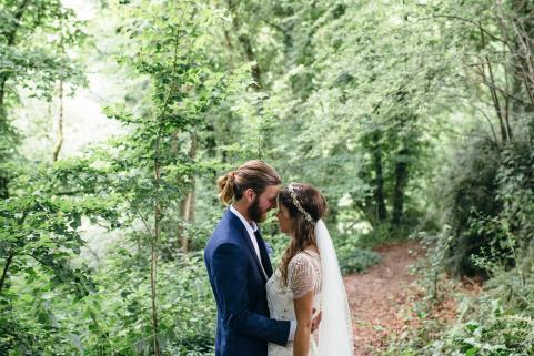 Bride and groom in woodland