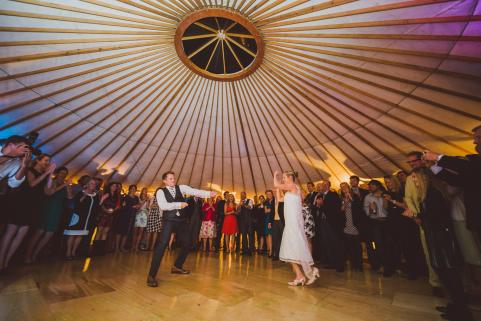 Dancing on wooden dance floor in yurt