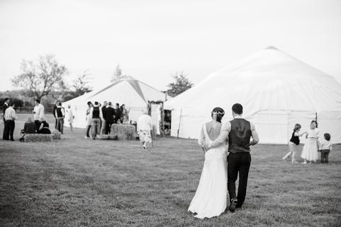 Bride and Groom walk to yurt